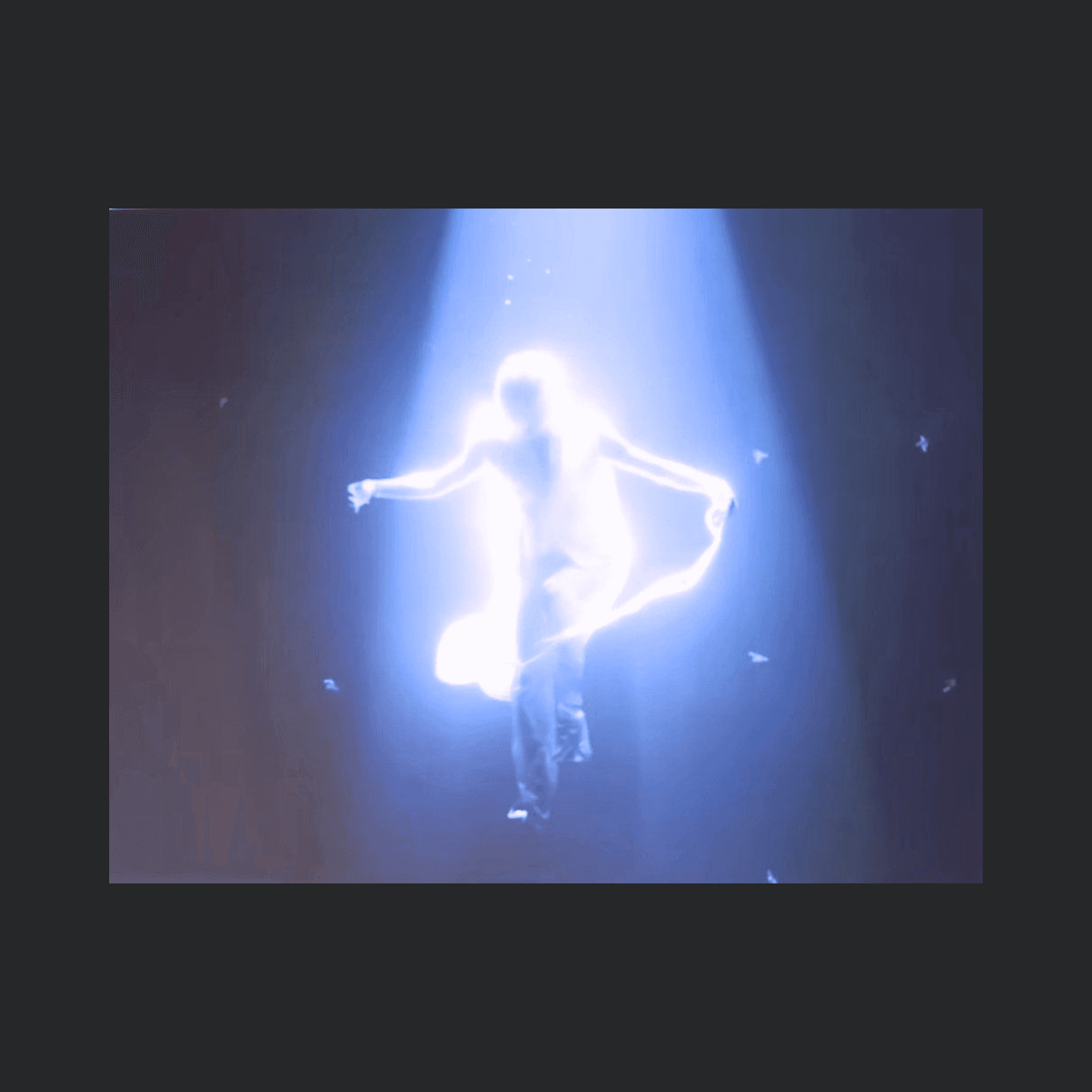Moonrize — luminous figure mid-performance